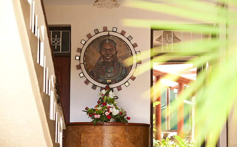 Grace House entrance with Maasai portrait